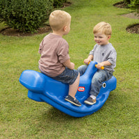 Load image into Gallery viewer, Two children playing on a blue toy rocker in a grassy area.