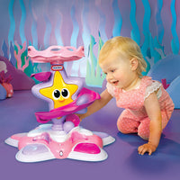 Load image into Gallery viewer, Child playing with a starfish-shaped toy in an underwater-themed room