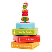 Load image into Gallery viewer, Figurine of a character from 'How the Grinch Stole Christmas' on top of books with text, on a white background