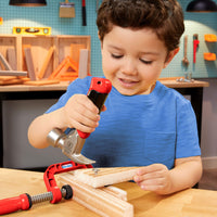 Load image into Gallery viewer, Child playing with toy hammer and clamps on a wooden surface