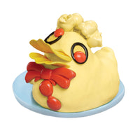 Load image into Gallery viewer, Yellow duck cake made with play sand with red accents on a white background