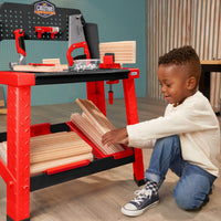 Load image into Gallery viewer, Boy stacking foam wood under workbench