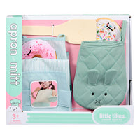 Load image into Gallery viewer, A boxed children's play cookware set labeled 'apron mitt' and 'little likes sweet spaces,' containing pastel-colored quilted oven mitts and apron-style fabric pieces with pretend cooking accessories visible inside the packaging.