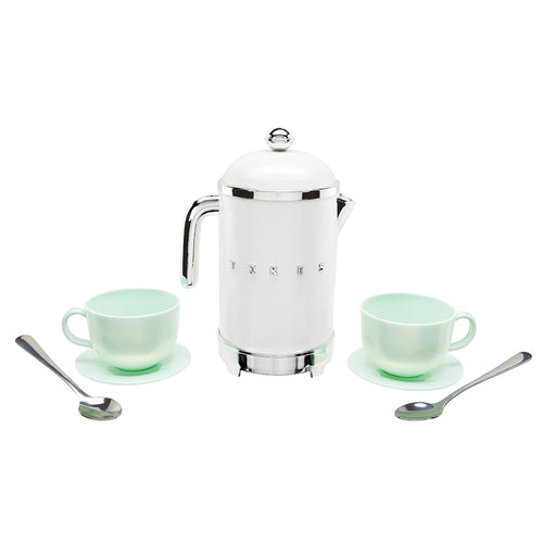 A retro-style white coffee pot with chrome trim, flanked by two matching mint green teacups on saucers and two silver spoons, arranged symmetrically on a white background.