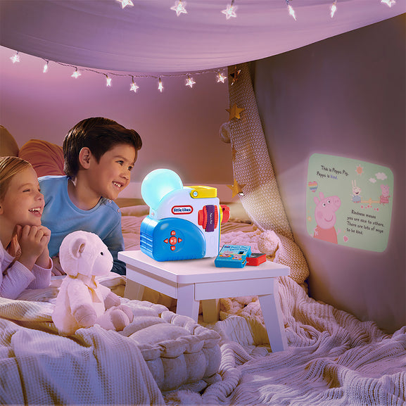 Children in a bedroom with a toy projector and colorful lights.