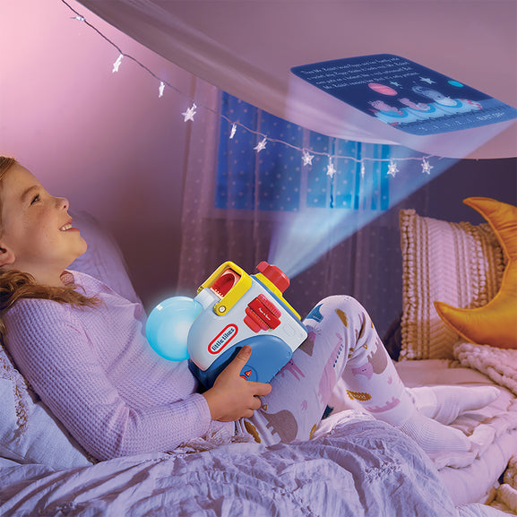 Child playing with a toy projector in a bedroom