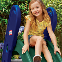 Load image into Gallery viewer, Young girl sitting on a blue and green Little Tikes slide in a garden, wearing a yellow top with floral pattern
