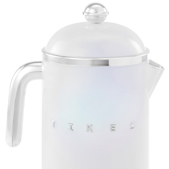 A white retro-style French press coffee maker with silver metallic accents, including a handle, rim, lid knob, and embossed brand lettering on the front, shown against a plain white background.

