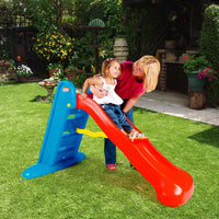 Load image into Gallery viewer, Woman and child playing on a red slide in a garden setting
