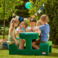 Load image into Gallery viewer, Children playing at a green outdoor picnic table in a garden setting.
