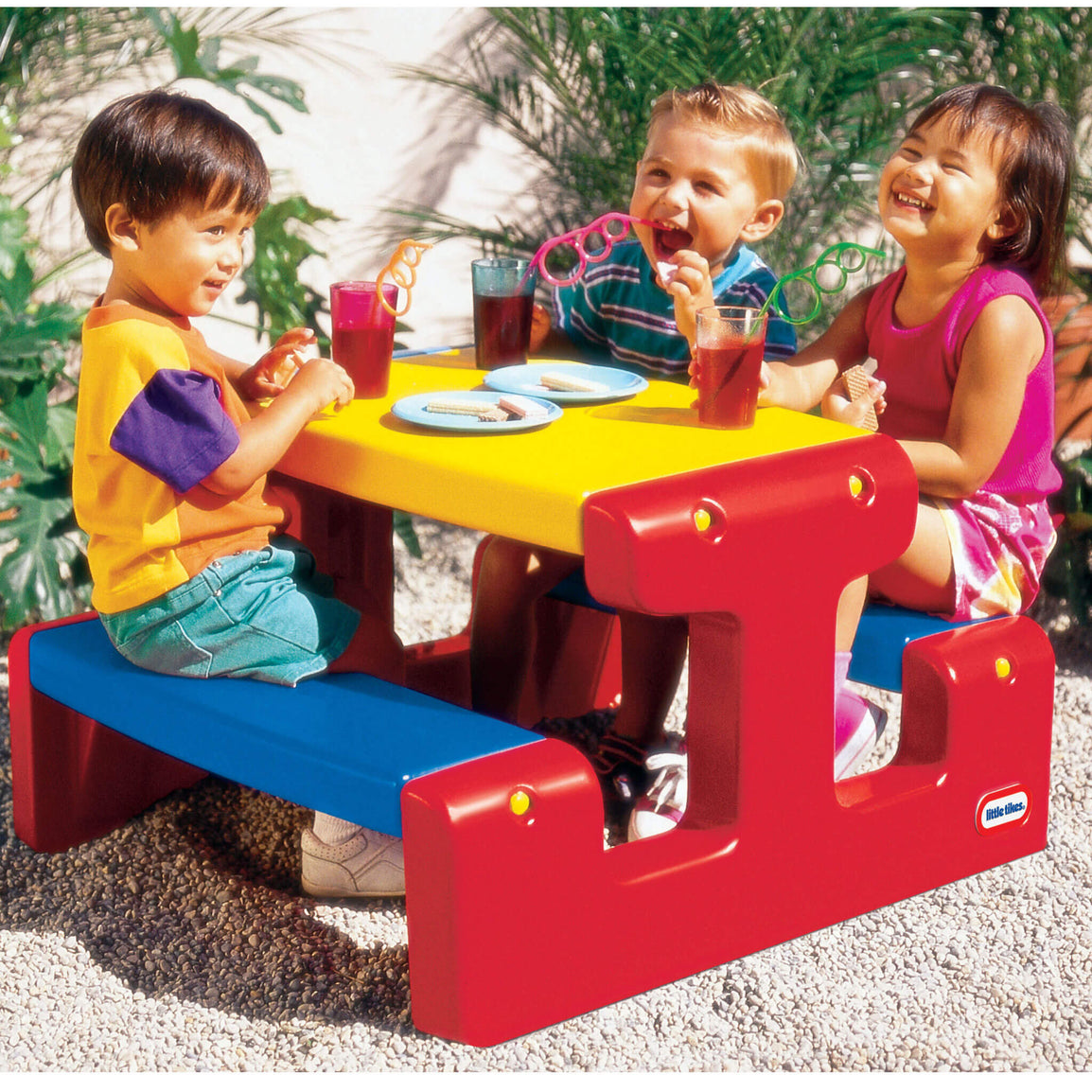 kids sitting at the Primary Picnic Table