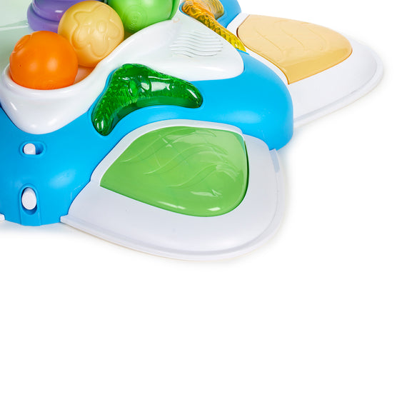 Colourful toy with a blue base, green accents, and small balls on a white background
