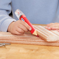 Load image into Gallery viewer, Child using a red tool on a wooden surface with a blue sweater
