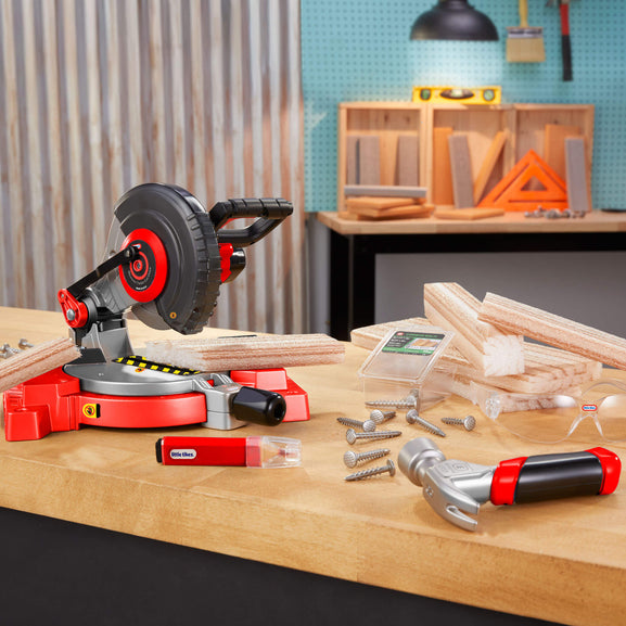 Woodworking tools including a miter saw, hammer on a workbench.