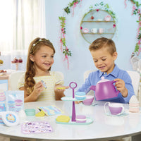 Load image into Gallery viewer, Two children playing with a toy tea set in a decorated room.
