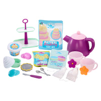 Load image into Gallery viewer, Toy baking set with purple teapot, cake mix packages, and utensils on a white background
