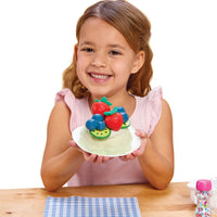Load image into Gallery viewer, Young girl holding the cake with fruits on a white background
