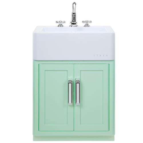 A mint green bathroom vanity cabinet with two doors, silver handles, and a white integrated sink basin with a chrome faucet, shown on a plain white background.