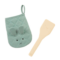 Load image into Gallery viewer, A baby kitchen accessory set featuring a mint green quilted oven mitt with a bunny face and a light beige silicone spatula, shown on a plain white background.
