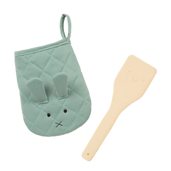 A baby kitchen accessory set featuring a mint green quilted oven mitt with a bunny face and a light beige silicone spatula, shown on a plain white background.