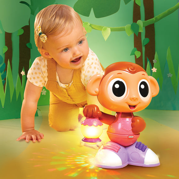 Child playing with a toy monkey