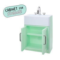 Load image into Gallery viewer, A mint green bathroom vanity cabinet with an open door showing storage space, a white sink basin, and a chrome faucet. A light blue badge in the top left says 'CABINET FOR STORAGE!'.
